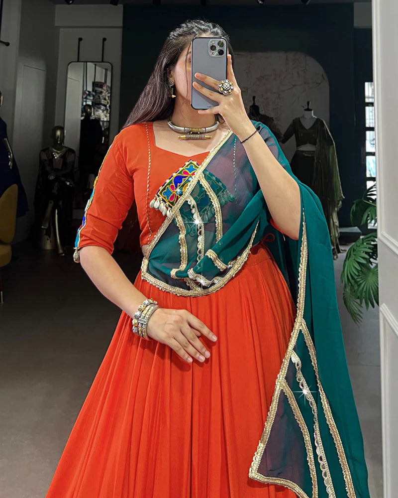 Womenline Orange Color Rayon Embossed Navratri Lehenga Choli