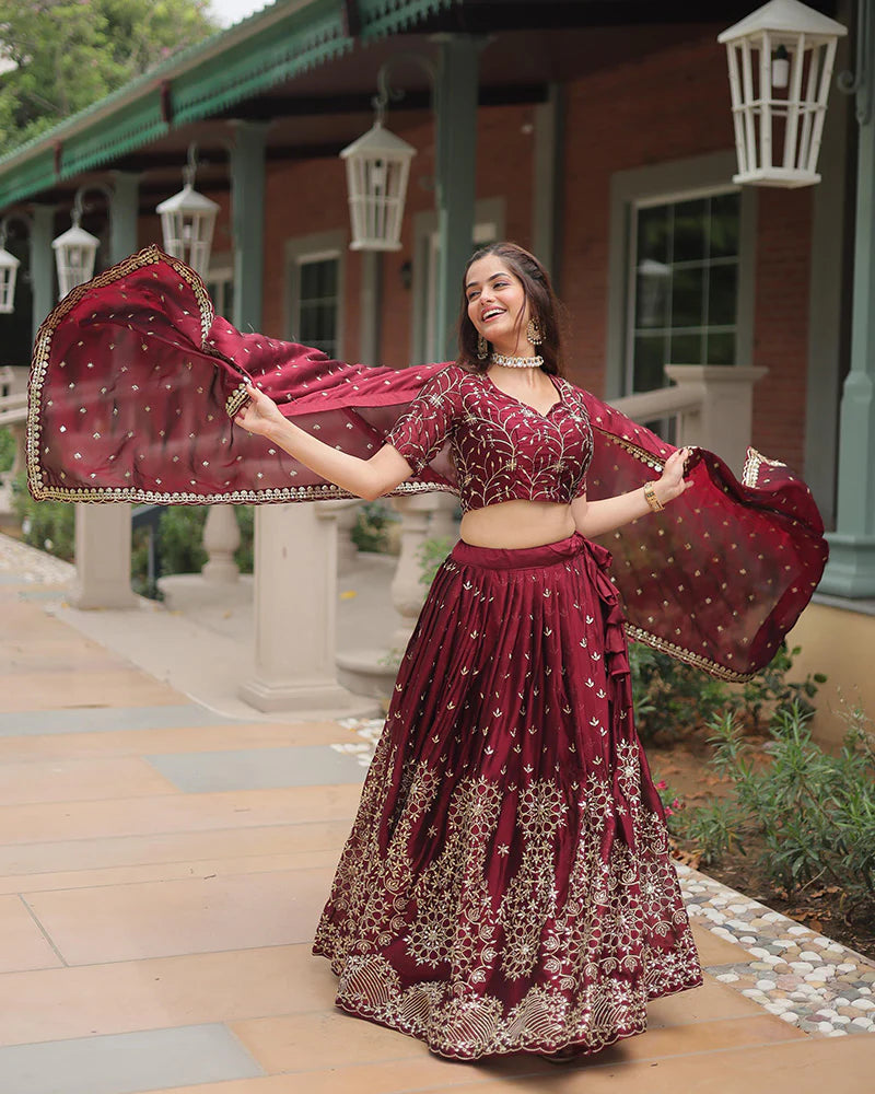 Womenline Maroon Color Rangoli Silk Embroidered Lehenga Choli
