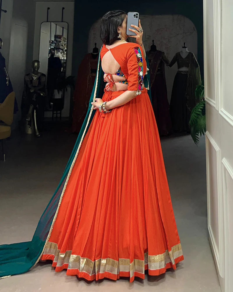 Womenline Orange Color Rayon Embossed Navratri Lehenga Choli