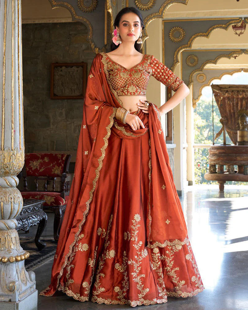 Womenline Rust Orange Color Rangoli Silk Embroidered Lehenga Choli