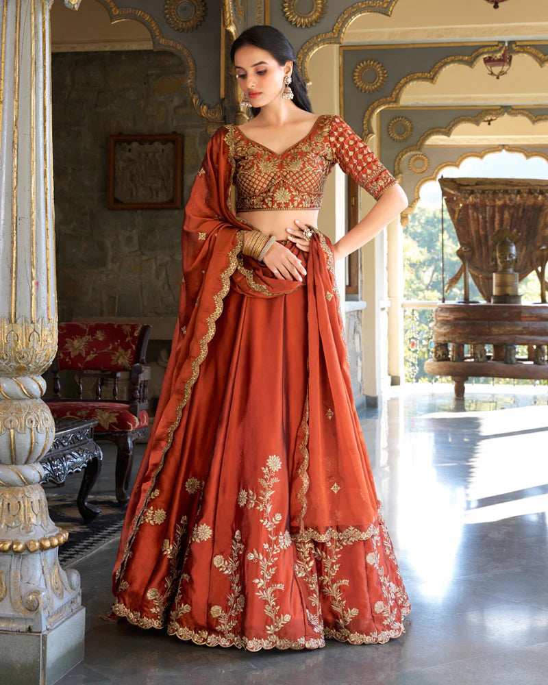 Womenline Rust Orange Color Rangoli Silk Embroidered Lehenga Choli