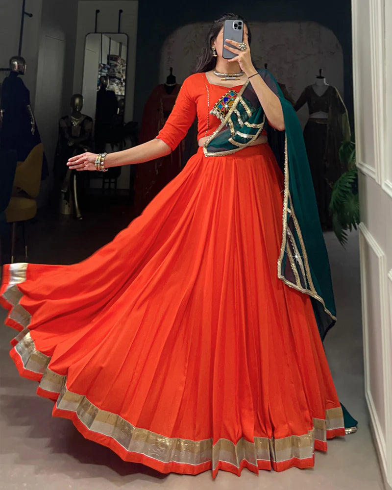 Womenline Orange Color Rayon Embossed Navratri Lehenga Choli