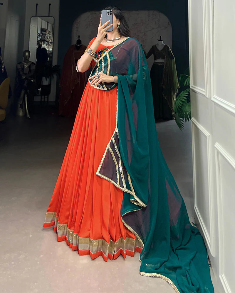 Womenline Orange Color Rayon Embossed Navratri Lehenga Choli