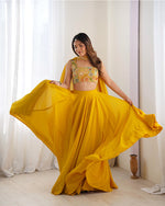 Womenline Yellow Color Pure Soft Georgette Lehenga Choli
