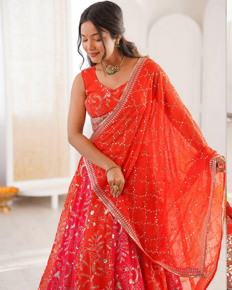 Womenline Orange Color Faux Georgette Embroidered Sequence Lehenga Choli