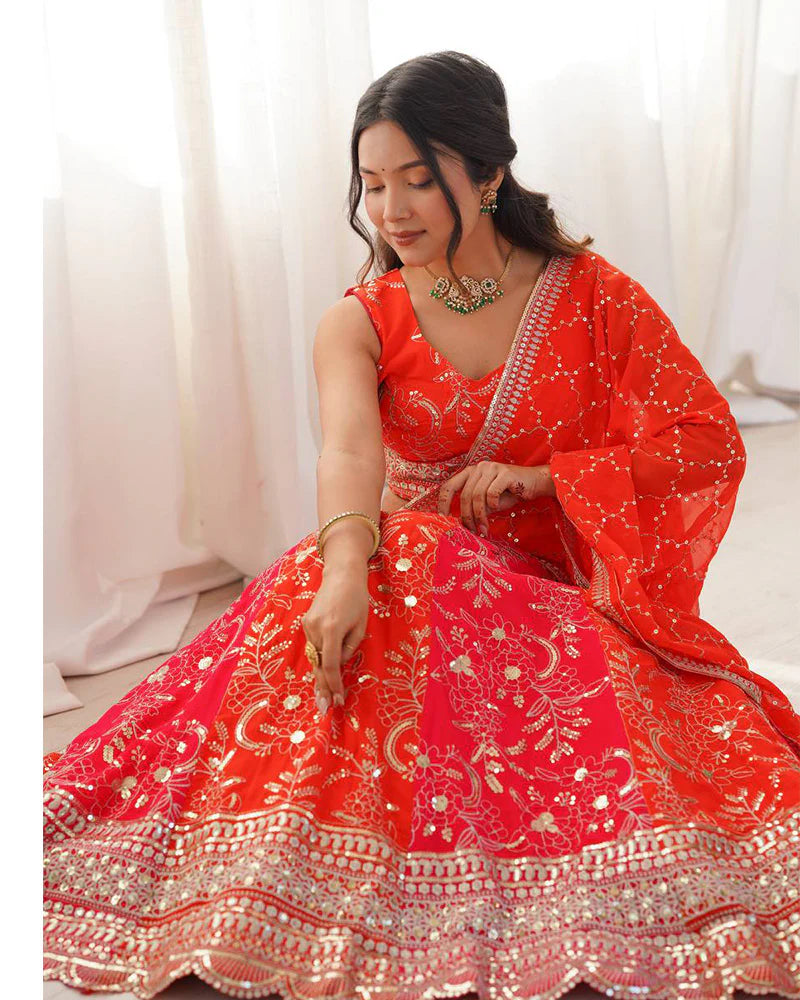 Womenline Orange Color Faux Georgette Embroidered Sequence Lehenga Choli