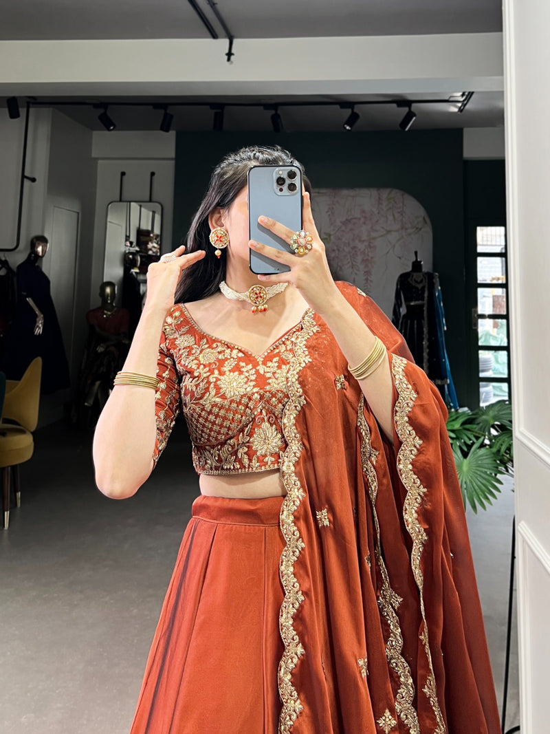 Womenline Rust Orange Color Rangoli Silk Embroidered Lehenga Choli