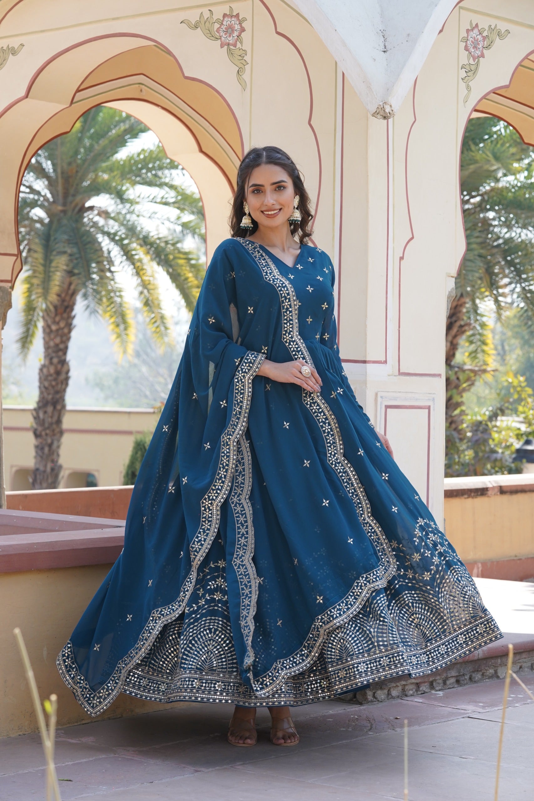 Womenline Rama Color Faux Georgette With Zari Gown