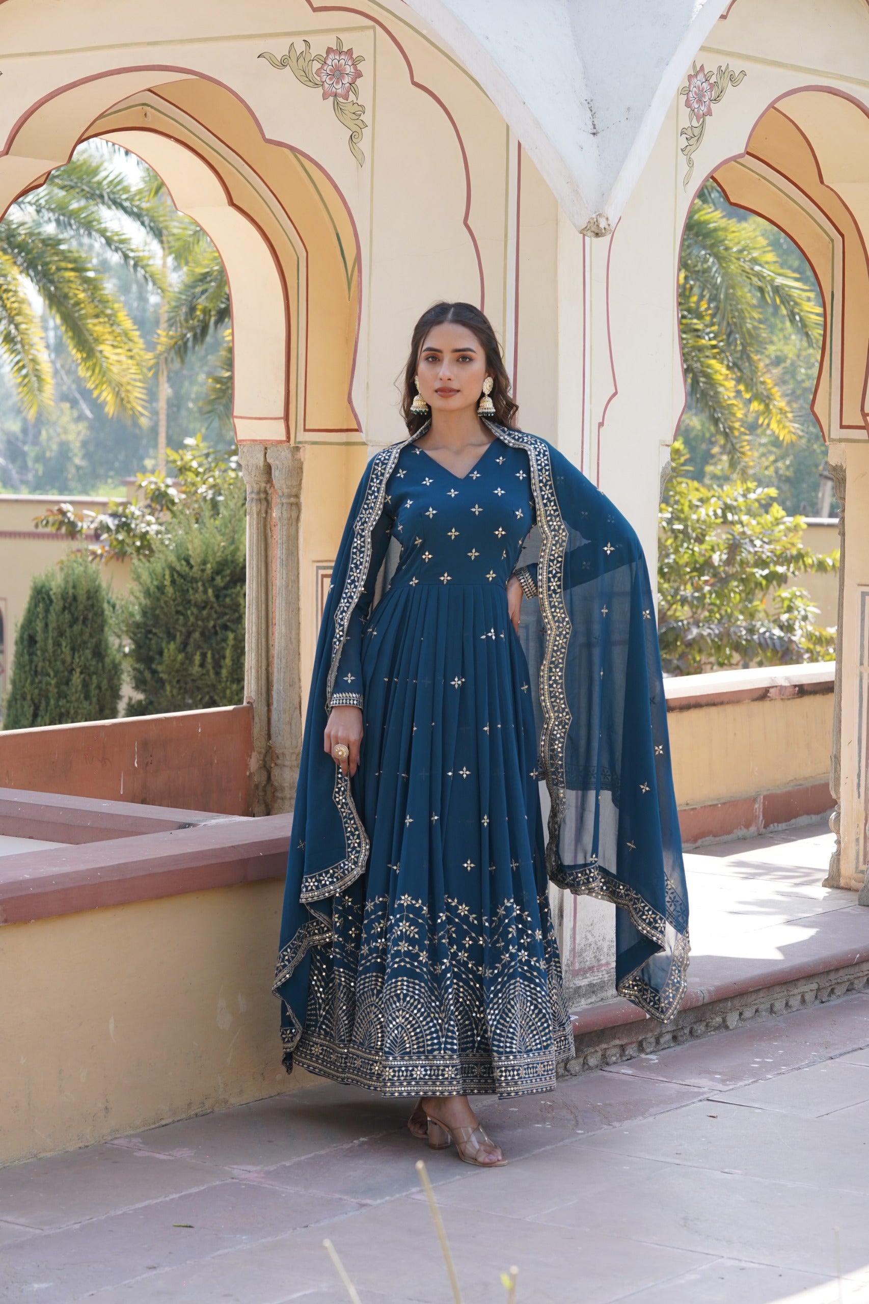 Womenline Rama Color Faux Georgette With Zari Gown