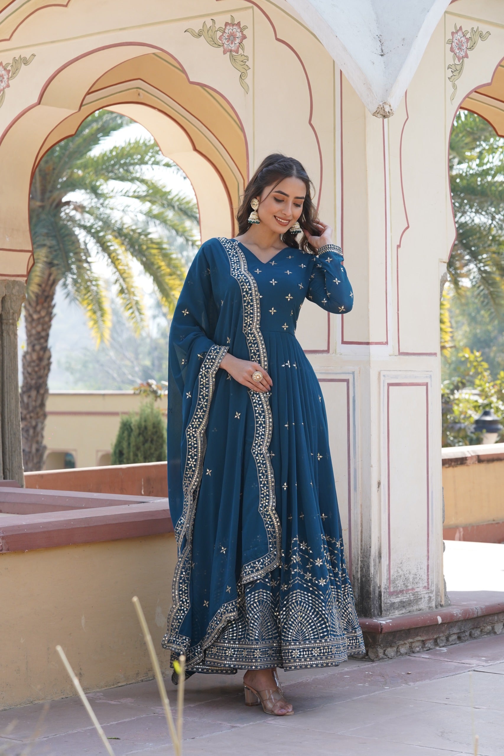 Womenline Rama Color Faux Georgette With Zari Gown