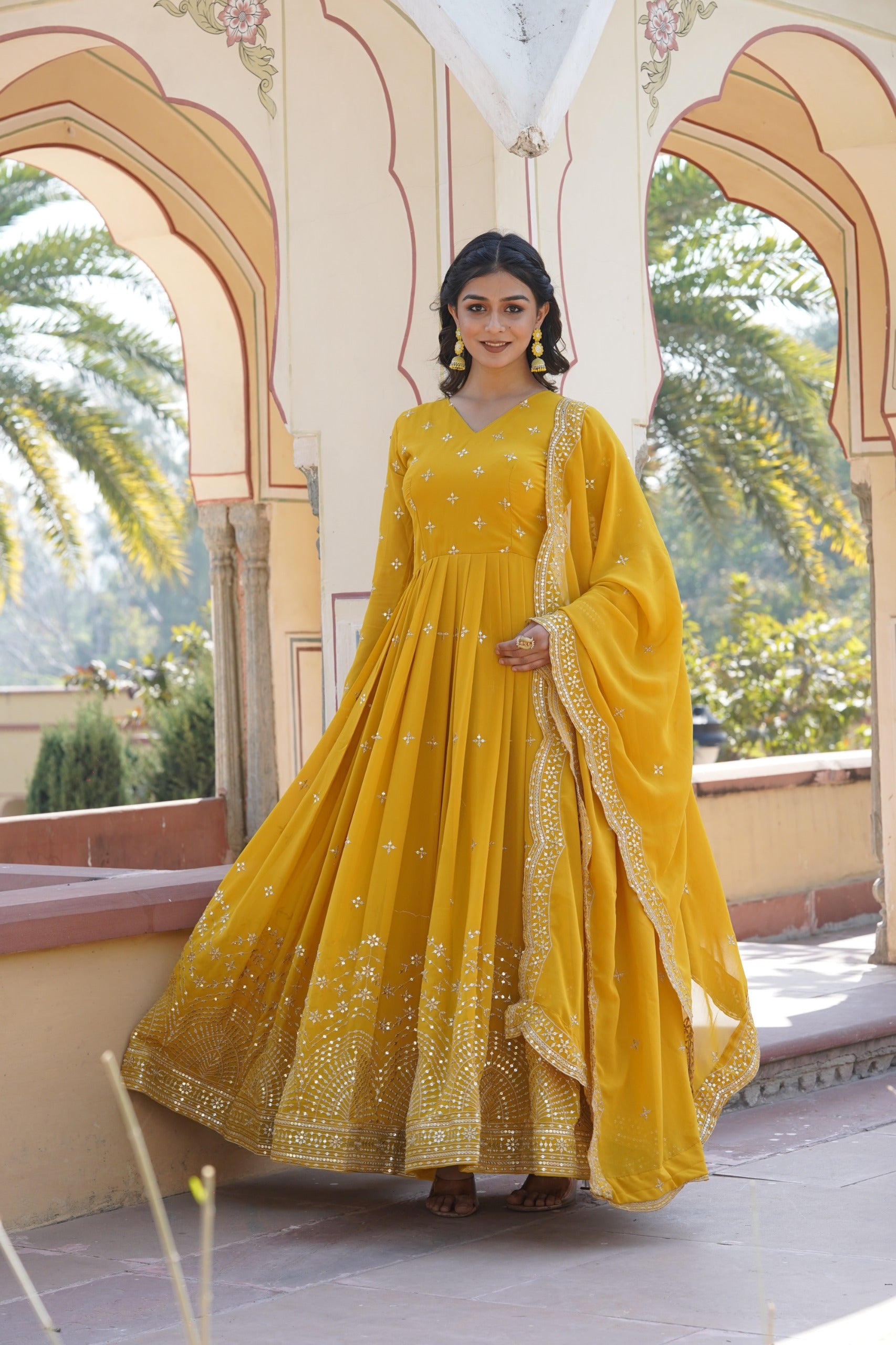 Womenline Yellow Color Faux Georgette With Zari Gown