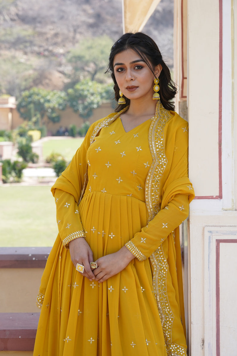 Womenline Yellow Color Faux Georgette With Zari Gown