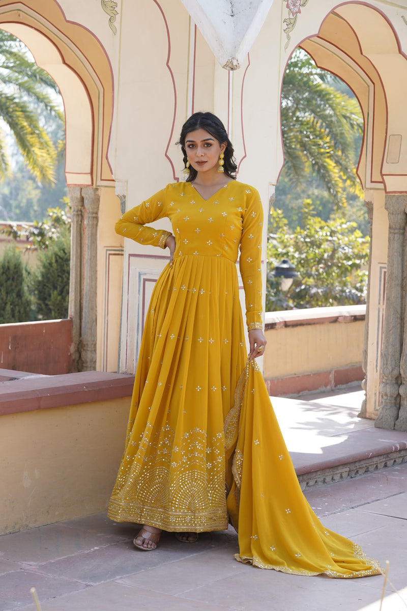 Womenline Yellow Color Faux Georgette With Zari Gown