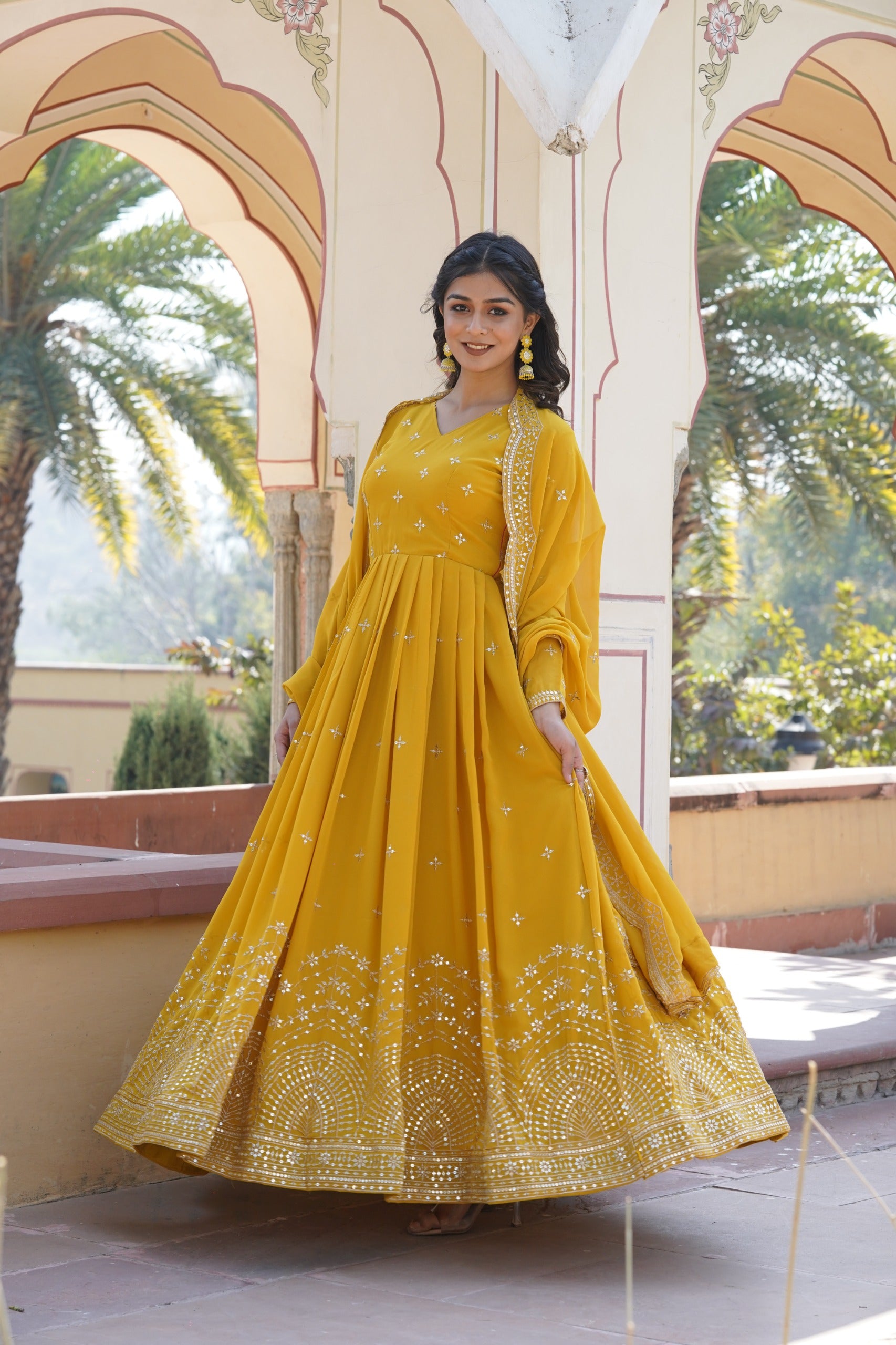 Womenline Yellow Color Faux Georgette With Zari Gown