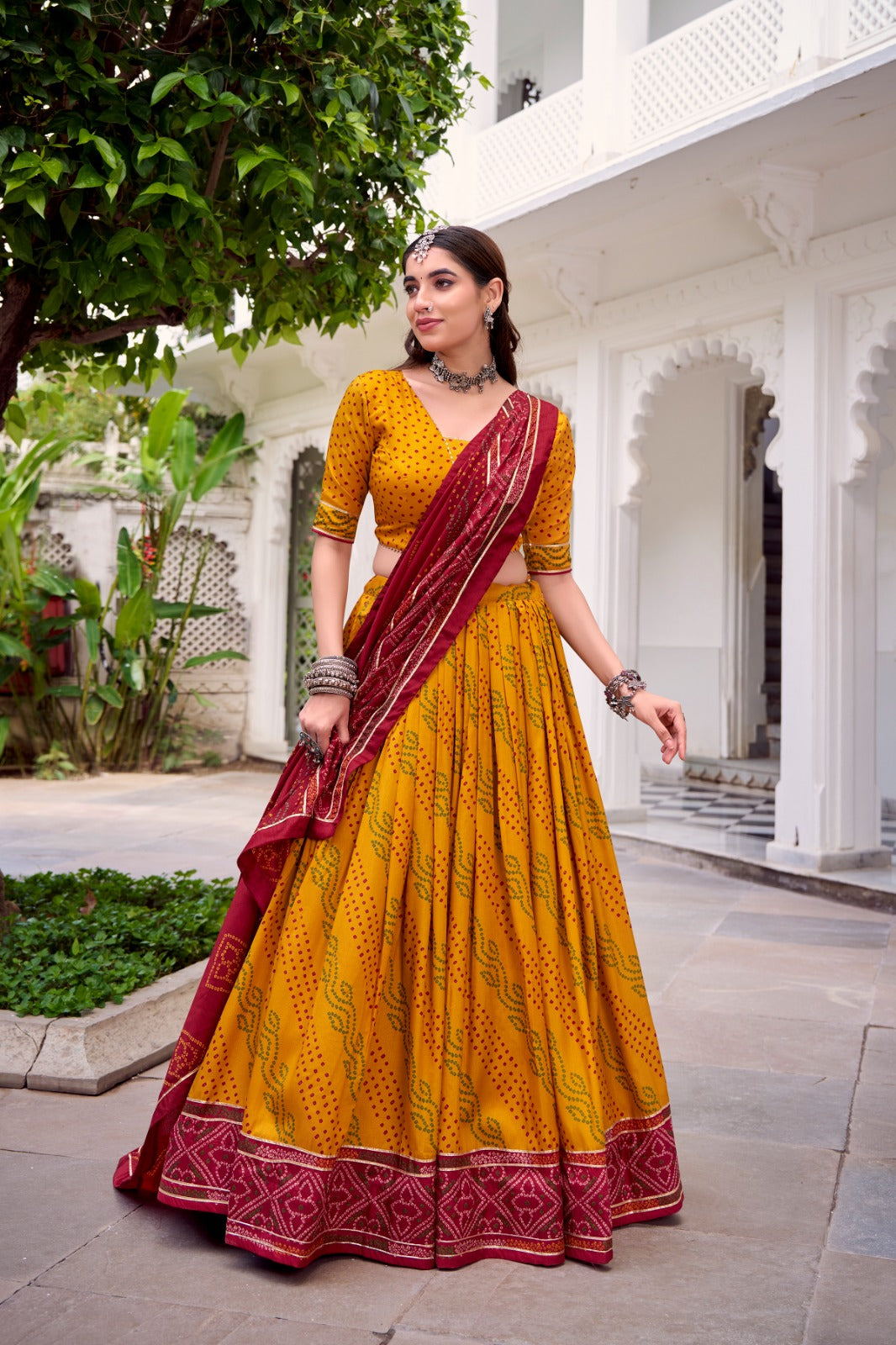 Womenline Elegant Yellow Color Tussar Silk Bandhej Navratri Lehenga Choli