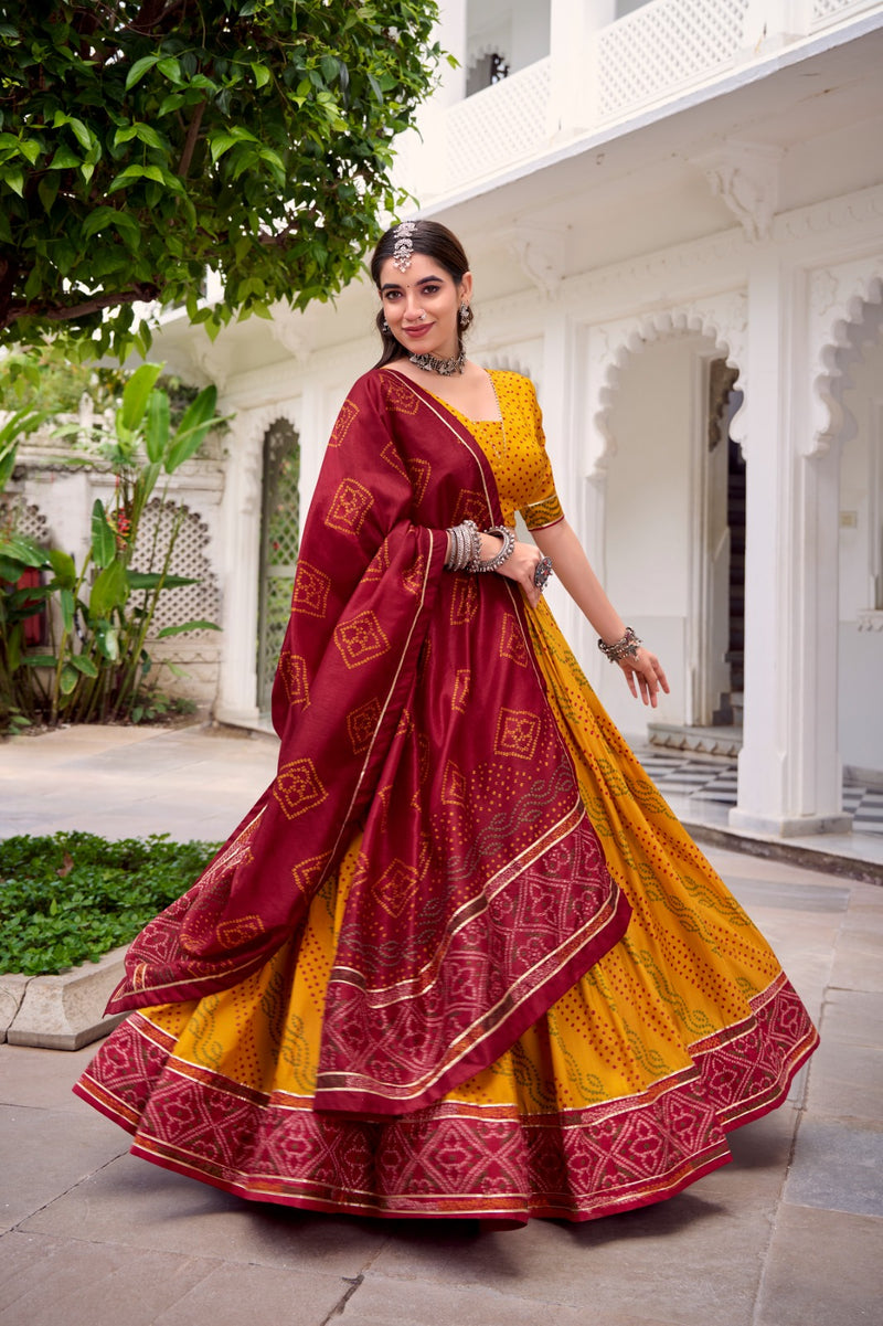 Womenline Elegant Yellow Color Tussar Silk Bandhej Navratri Lehenga Choli