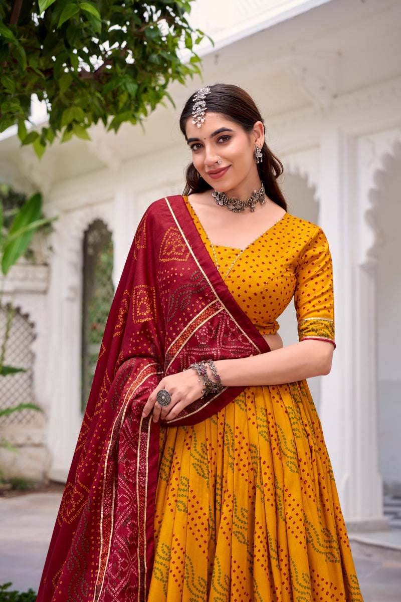 Womenline Elegant Yellow Color Tussar Silk Bandhej Navratri Lehenga Choli