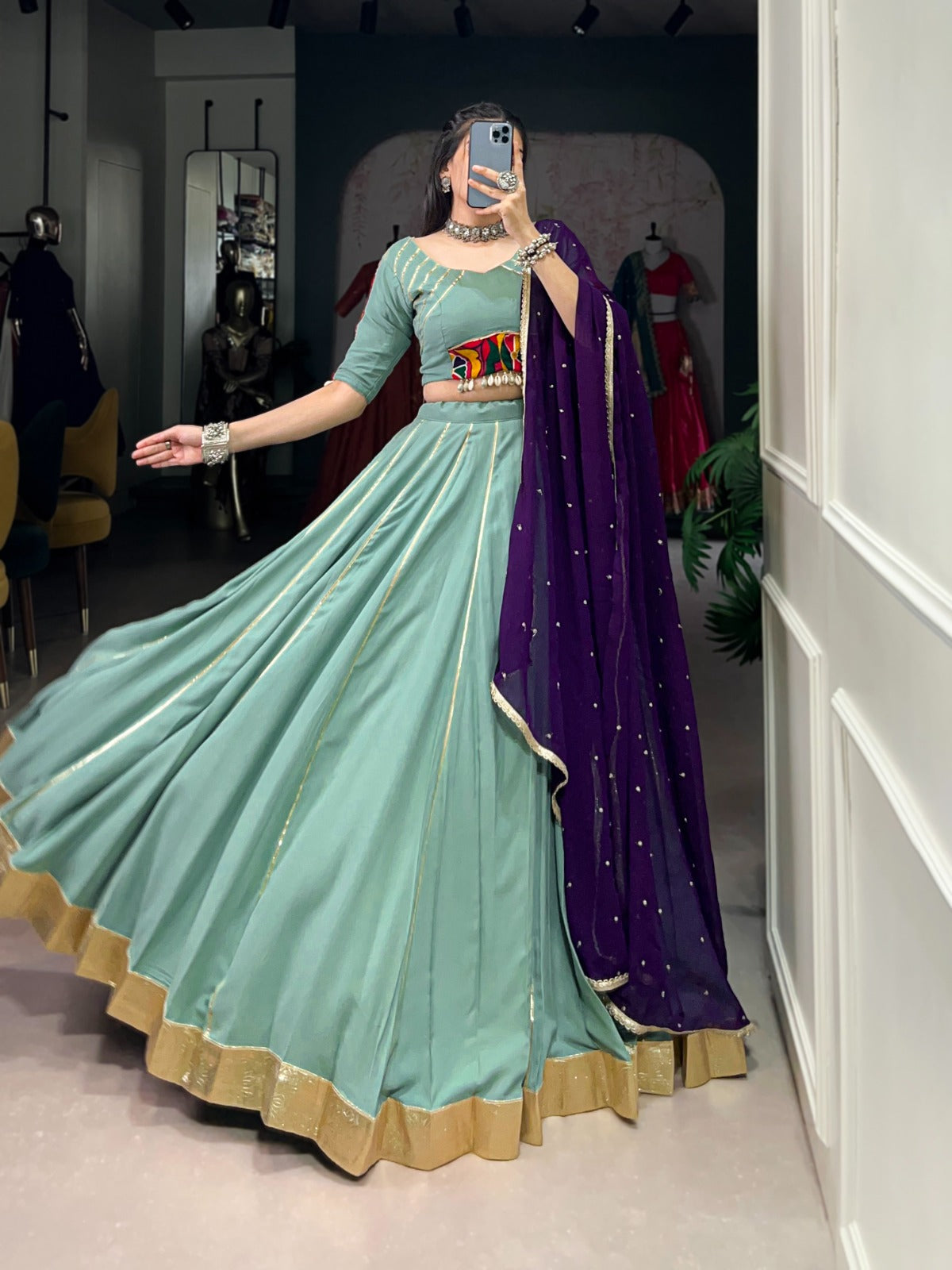 Womenline Sea Green Color Rayon Embossed Navratri Lehenga Choli