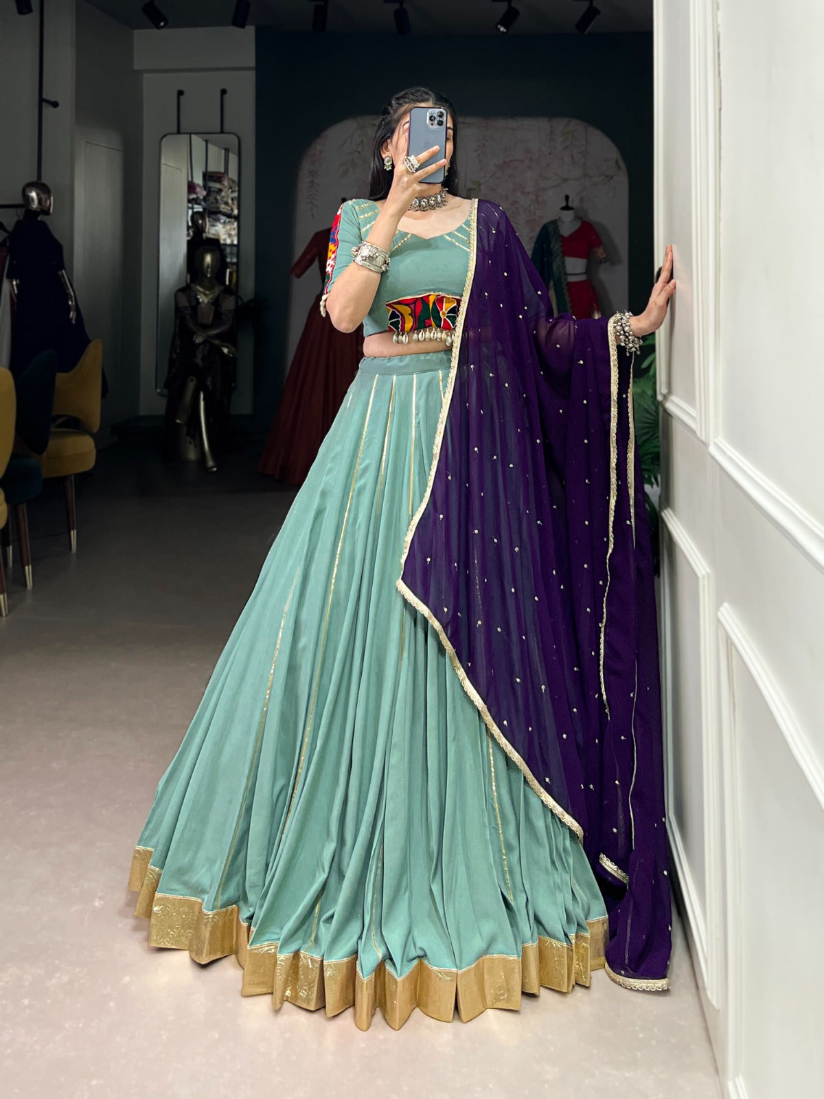 Womenline Sea Green Color Rayon Embossed Navratri Lehenga Choli