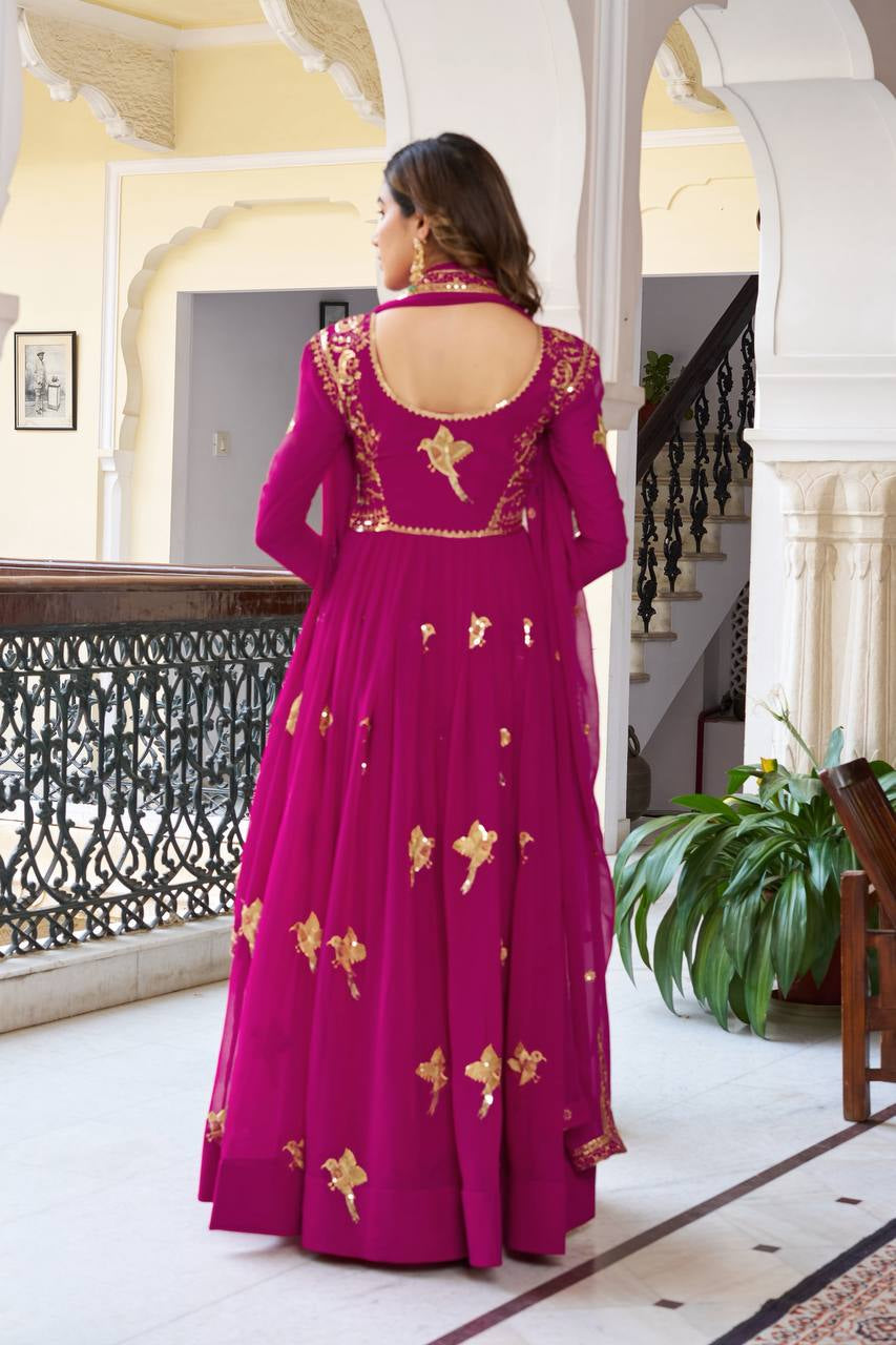Womenline Elegant Rani Pink Anarkali Gown Set with Golden Bird Motif Embroidery & Dupatta