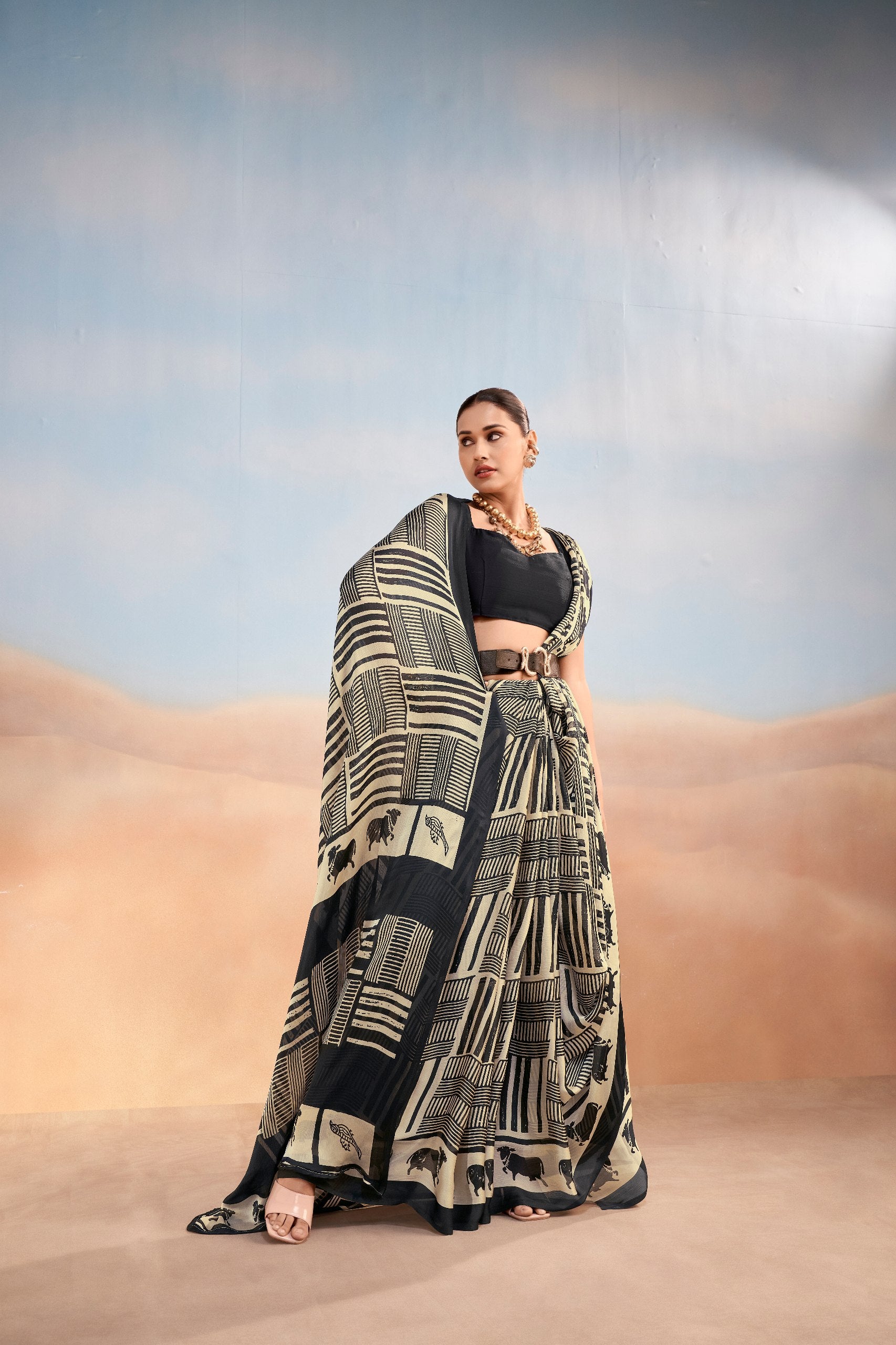 Womenline Black & Beige Printed Saree with Geometric & Animal Motif Design