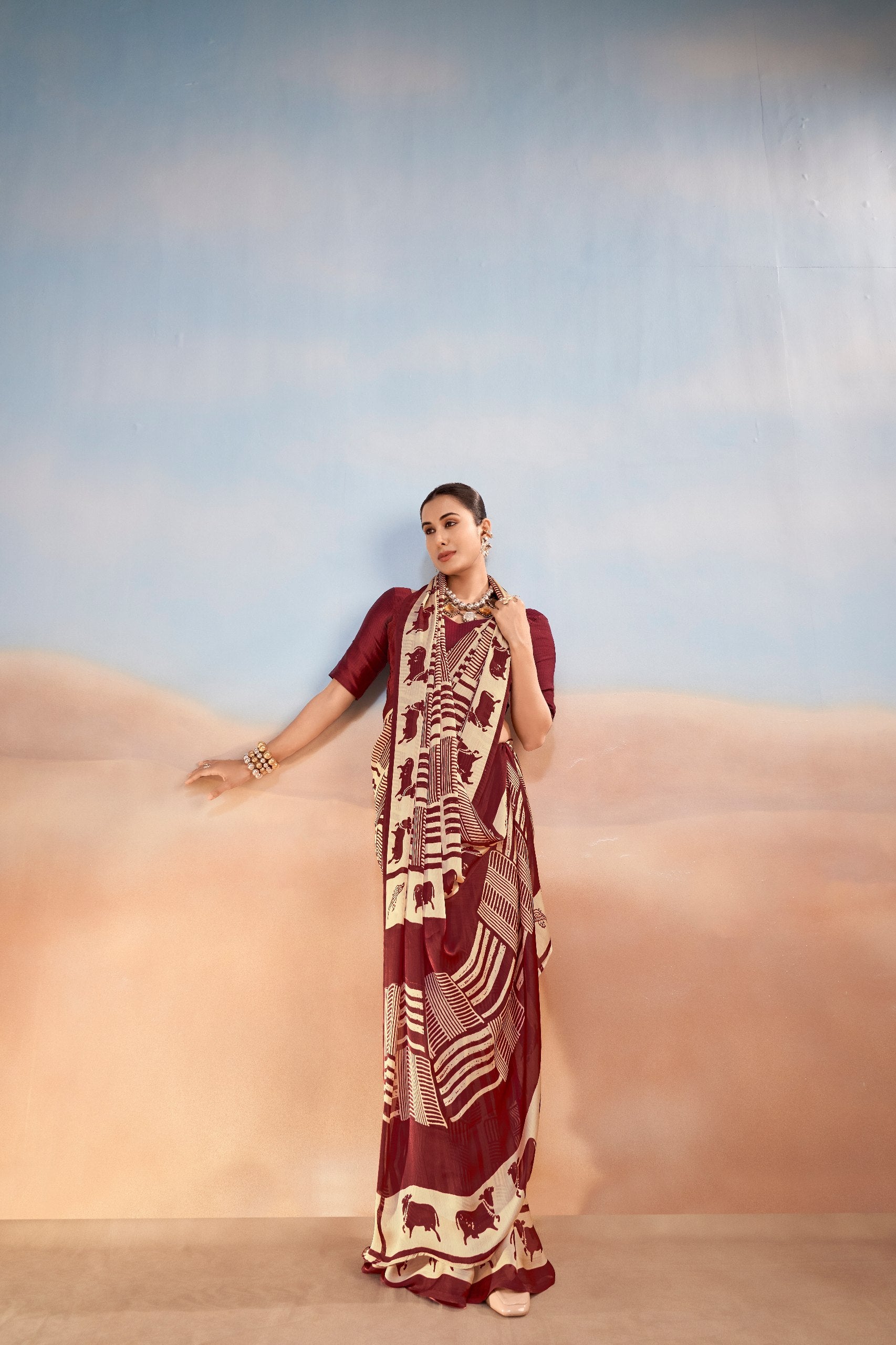 Womenline Maroon & Beige Printed Saree with Geometric & Animal Motif Design